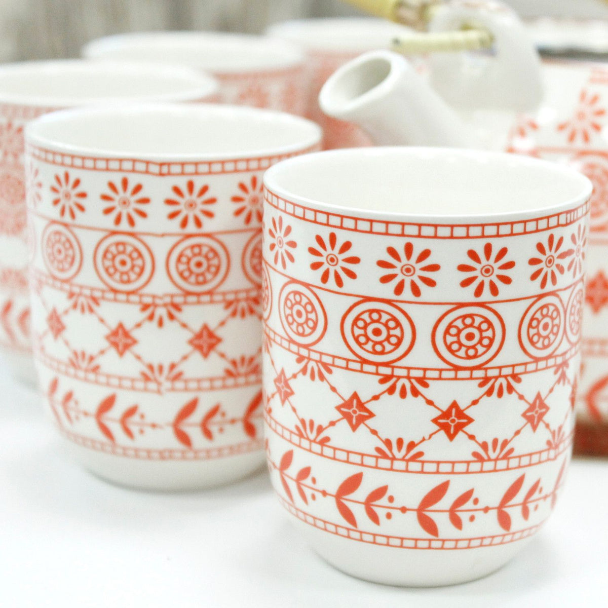 Teeservice-Set "Amber" mit Teekanne und sechs Tassen in rötlichem Muster, elegant und ideal für Teeliebhaber.
